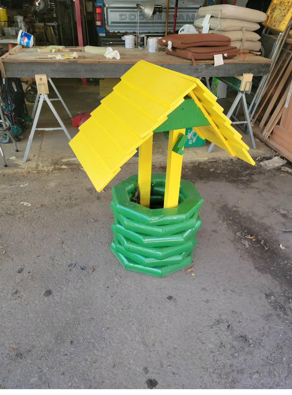 Decorative wishing well in Green Bay Packers colors, green and gold