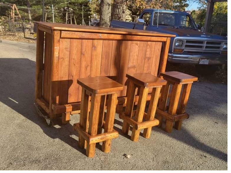 Handcrafted wooden bar with 3 matching bar stools, warm stain