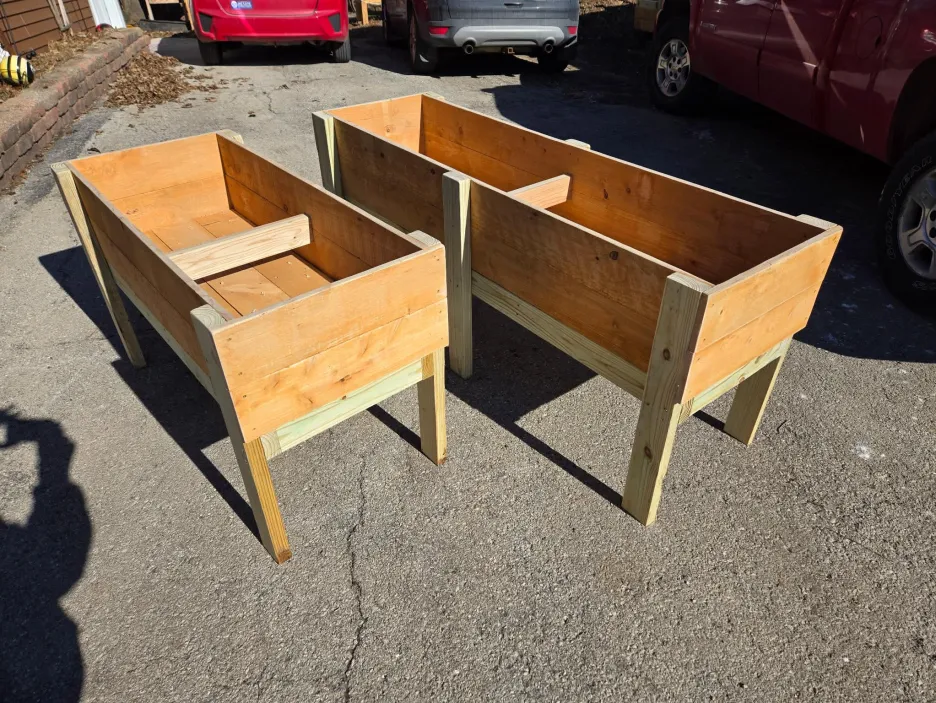 Two elevated raised garden boxes in 4-foot and 6-foot sizes with natural wood construction and sturdy legs
