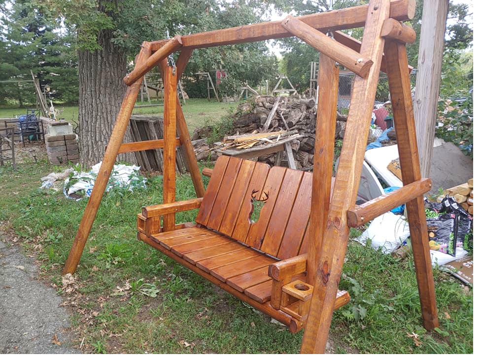 A-frame swing with carved deer/buck cutout on backrest